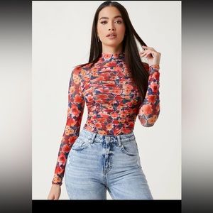 Sheer mock neck floral top